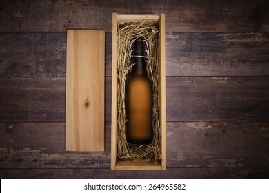 Craft Beer Bottle In A Wooden Gift Box On A Rustic Table