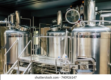 Craft beer brewing equipment in brewery! Metal tanks