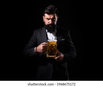 Craft Beer. Confident Man With Glass Of Beer On Black.