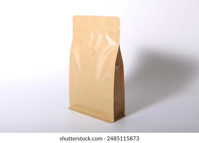 Craft coffee bag packaging, brown craft ziplock foil package with valve and seal insulated, front view isolated on white background. Packaging template mockup collection. Aluminium coffee package.