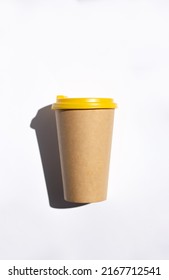 Craft Coffee Cup With Yellow Cover Top View, From Above. Tea Take Away. Mock-up Friendly