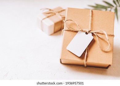 Craft Eco Gift Or Present Box With Blank Mockup Tag, Bow And On White Background. Copy Space For Text And Design. Soap, Zero Waste, Plastic Free, Eco Friendly Concept.