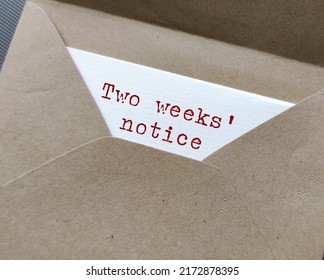 Craft envelope and document with typed text words - Two Weeks' Notice , means employee courtesy to give employer time to prepare for resignation and hiring someone else