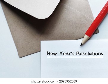 Craft Envelope, Pencil And Note With Handwritten Text NEW YEAR'S RESOLUTIONS - A Self Promise To Start Doing Something Good, Make Life Better, Or Stop Bad Habits In The Coming New Year