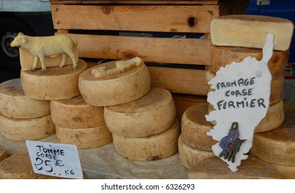 Craft Ewe's Cheeses In A Market In Corsica