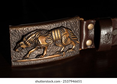 craft hand made forged pattern wild wolf shape pattern on badge for belt close up object view