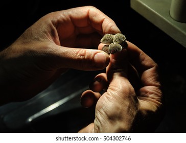 Craft Jewelery Making. Jeweler Fixes Sapphires On The Ring.