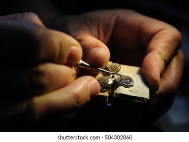 Craft Jewelery Making. Jeweler Fixes Sapphires On The Ring.