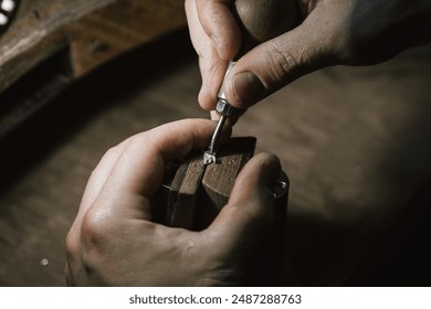 Craft jewelery making. Repairing jewel by inlaid tight gem. - Powered by Shutterstock