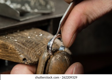 Craft jewelery making.  Repairing ring by inlaid tight gem. - Shutterstock ID 262209329