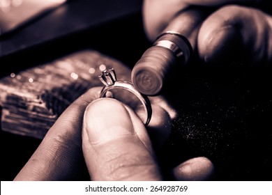 Craft jewelery making. Ring polishing. Macro shot. Monochrome cream tone. Black and white photography. - Powered by Shutterstock