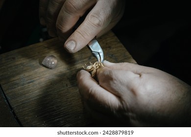 Craft jewelery making. Ring repairing. Putting the gems on the ring. Macro shot. - Powered by Shutterstock