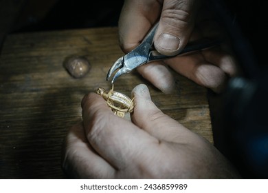 Craft jewelery making. Ring repairing. Putting the gems on the ring. Macro shot. - Powered by Shutterstock