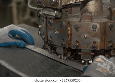 Craft Metalworking - holes are punched in metal parts - Shutterstock ID 2269559205