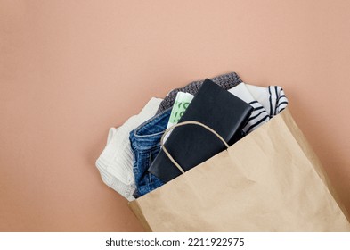 Craft Paper Bag With Full Of Used Clothing  For Recycling Or Donation. Second Hand Wardrobe Idea. Recycle Clothes, Eco Cotton. Donation To The Needy