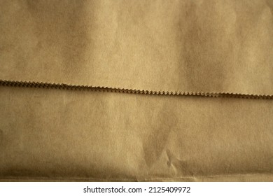 Craft Paper. Brown Wrapping Paper. Fold In Material. Cardboard Texture.