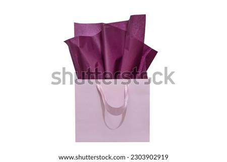 Craft paper gift bag with tissue paper isolated on a white background