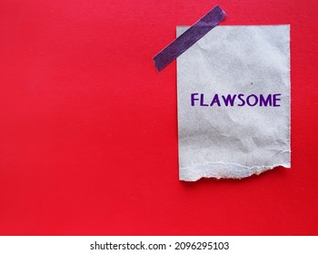 Craft paper stick on red copy space background with handwritten text FLAWSOME, refers to individual who embraces their flaws and loving themselves, knowing they are awesome, with all those flaws