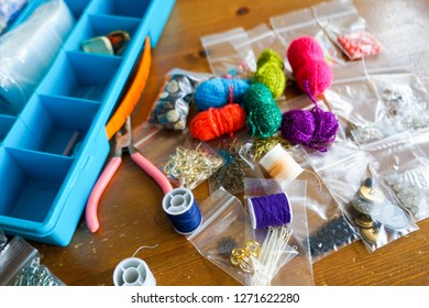 Craft Supplies Laid On The Table, With The Focus On Spool Threads. 