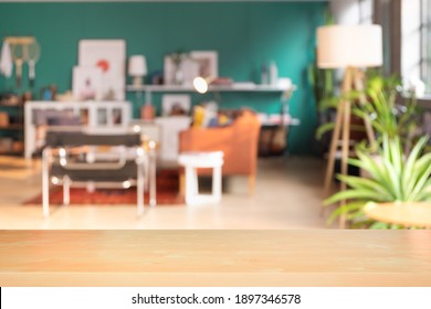 Craft Wooden Board Empty Table In Front Of Blurred Background. Perspective Light Wood Over Blur In Living Room Interior, Used For Display Or Montage Your Products. Mock Up For Display Of Product