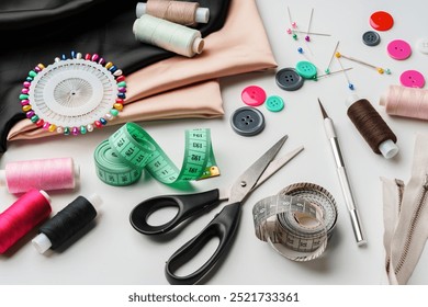 Crafting essentials for sewing projects displayed on a table with fabric, threads, and tools - Powered by Shutterstock