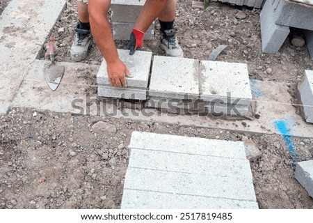 Crafting Solid Foundation With Precision Block Laying in Sunlit Construction Site