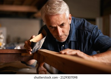 Craftmanship - Genius is 1 talent and 99 hard work. Cropped shot of a senior man working with wood indoors. Using a crafter, this is craftmanship. - Powered by Shutterstock