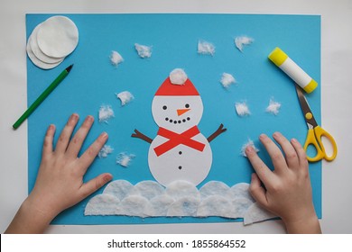 Crafts For Children. Little Child Making Winter Decoration From Paper And Cotton Disc. Children's Art Project. DIY Concept. Handmade Easy Paper Crafts For Kids