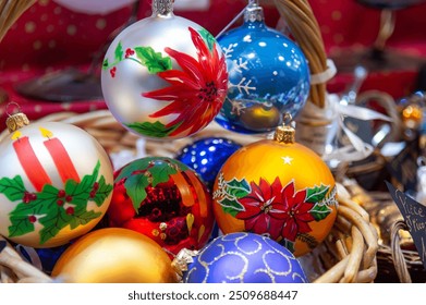 Crafts for Christmas celebrations, at the Christmas market in a wooden chalet a wide choice of Christmas baubles and decorations sometimes painted by hand to decorate the traditional tree - Powered by Shutterstock