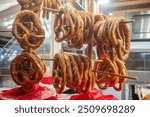 
Crafts for the Christmas holidays, at the Metz Christmas market, in a wooden chalet a manufacturer of large pretzels delights beer drinkers or children