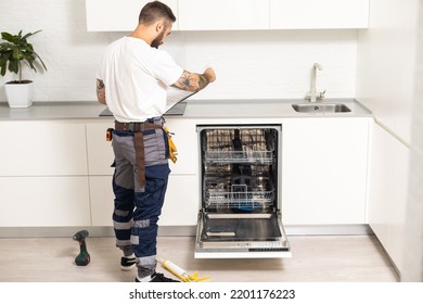 Crafts Man Repairs Broken Dishwasher