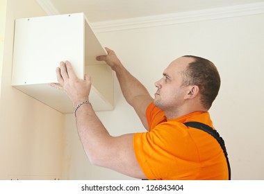 Craftsman Carpenter At Kitchen Cabinet Installation Service Work