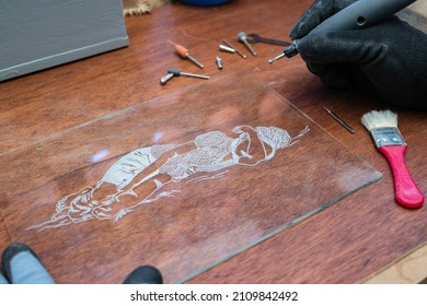 A Craftsman Does Glass Engraving With A Rotary Tool