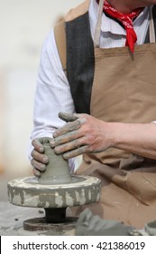 craftsman potter with the hand lathe du with clay - Shutterstock ID 421386019