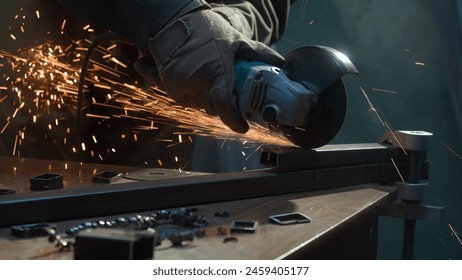 Craftsman in protective gloves working with grinder at industrial plant, man grinding iron detail, sparks flying around. - Powered by Shutterstock