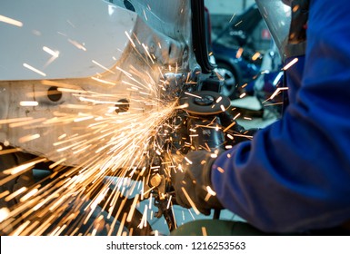 Craftsman repairman working with grinder