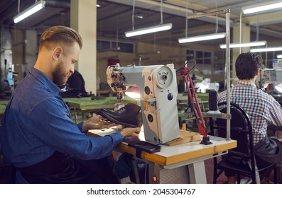 Craftsman Shoe Designer Repairing Or Sewing Boot On Industrial Stitching Machine. Footwear Making Process. Side View Shot. Handyman Shoemaker Working At Workplace Checking Item On Defect