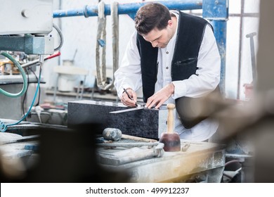 Craftsman templating gravures on headstone  - Powered by Shutterstock