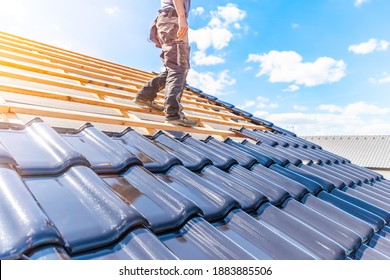 craftsman treasure a fired ceramic tile on the roof - Shutterstock ID 1883885506