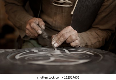 Craftsman Working On Stone Isolated On Hands