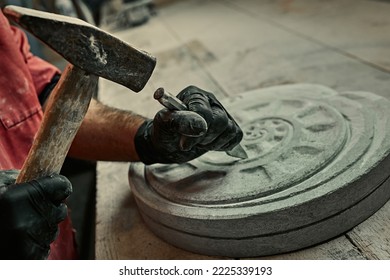 The craftsman works with stone with different tools. atmospheric photo. Sculpture making, handmade - Powered by Shutterstock