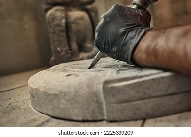 The craftsman works with stone with different tools. atmospheric photo. Sculpture making, handmade - Powered by Shutterstock