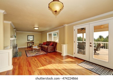 Craftsman-style Family Room   With Hardwood Floor, Beige Walls And Persian Red Rug. Northwest, USA