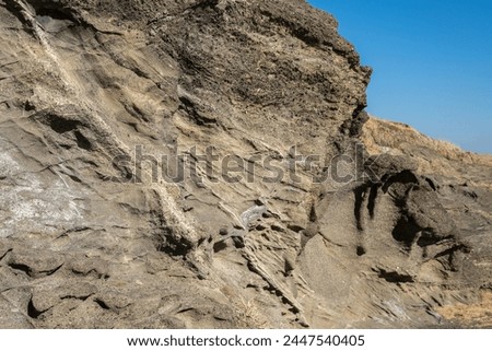 Craggy rock wall in seaside
