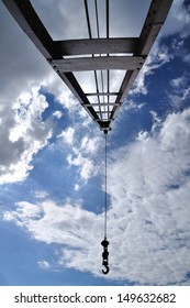 Crain With Iron Pendulum Hook With Blue Sky.