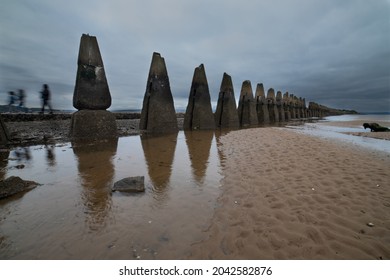 Cramond Causeway Near Edinburgh Leading to Cramond Island, this can be crossed at low tide.Signs at the start give safe crossing times.Were constructed as an anti-boat boom during the II World War