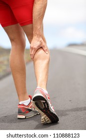 Cramps In Leg Calves Or Sprain Calf On Triathlete Runner. Sports Injury Concept With Running Man.