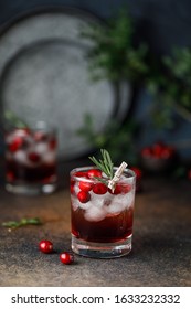 Cranberry Cocktail With Ice. Christmas Cranberry Beverage In Glasses Decorated With Sugar And Rosemary