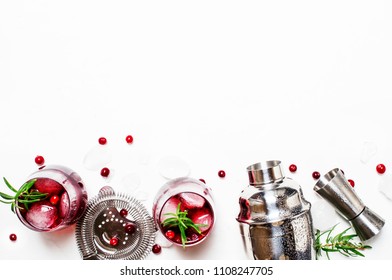 Cranberry Cocktail With Ice, Rosemary And Berries, Bar Tools, White Background, Top View