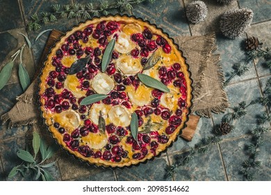 Cranberry Goat Cheese Tart With Sage On Rustic Blue Background, Top View